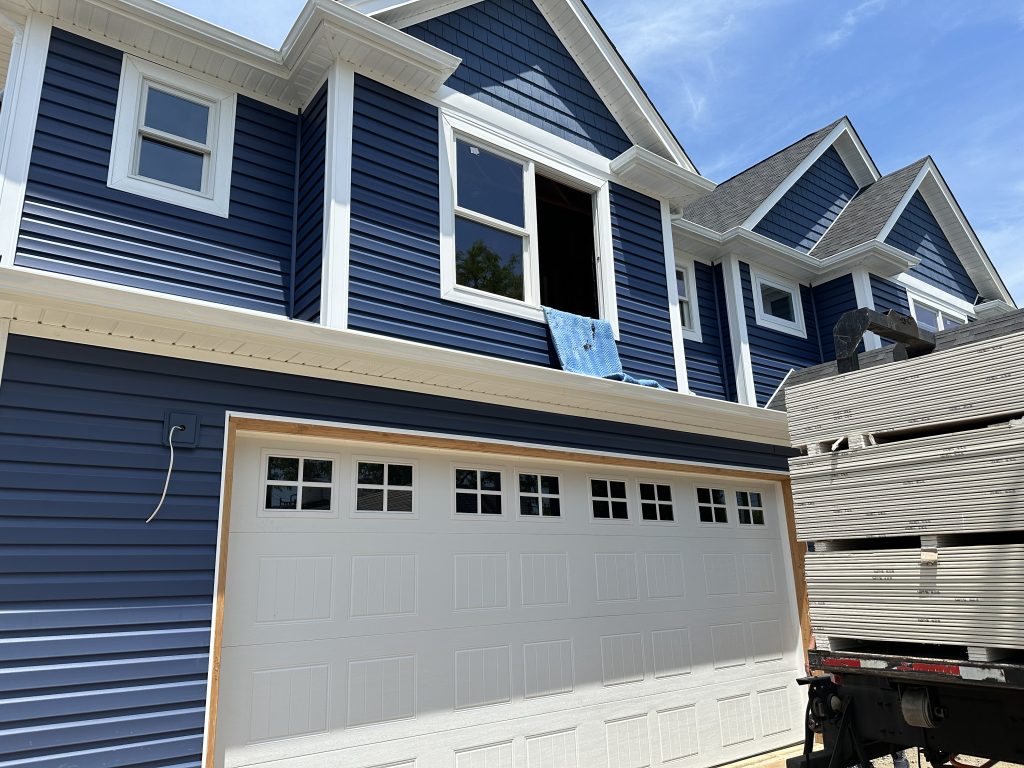Kirby Lane - West Babylon - Installed Garage door and blue siding